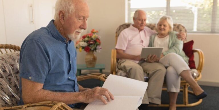 Elderly Man Reading Book in Cozy Independent Living Facility