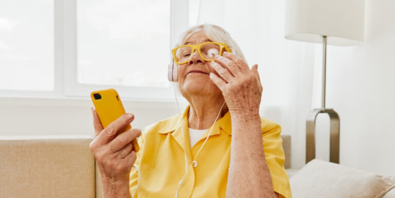 Elderly Woman Listening to Music in Senior Living Facility in San Antonio